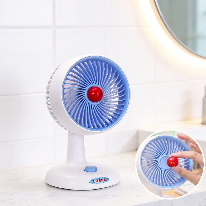 Automatic Oscillating Desktop Quiet Mini Fan, showing its white and blue two-tone appearance, spiral grille, and blue knob switch on the base.
