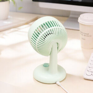 Automatic Oscillating Desktop Quiet Mini Fan, showing its white and blue two-tone appearance, spiral grille, and blue knob switch on the base.