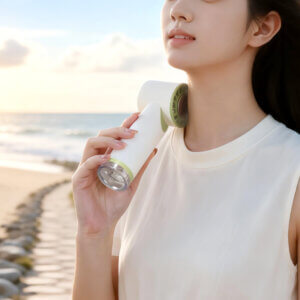 Semiconductor Ice Cooling Mist Spray Handheld Mini Fan, showing its central metal ice pad, air guide grille, fine mist nozzle below, and side control buttons, available in beige and white colorways.