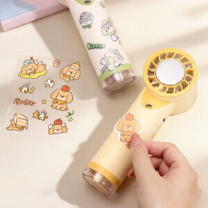 Semiconductor Ice Cooling Mist Spray Handheld Mini Fan, showing its central metal ice pad, air guide grille, fine mist nozzle below, and side control buttons, available in beige and white colorways.
