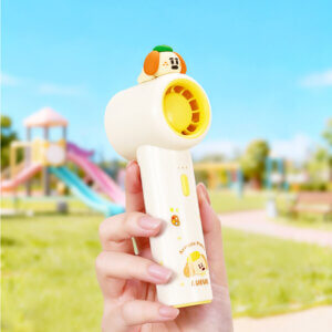 Cute Cartoon Figurine Handheld Mini Fan, showing its top 3D animal figurines, circular fan head, and printed handles in pink and yellow accents.
