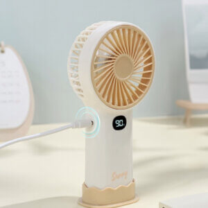 Smart Digital Display Portable Rechargeable Handheld Desktop Fan, showing its white body, warm beige front grille, LED digital display screen, side charging port, and wavy base stand.