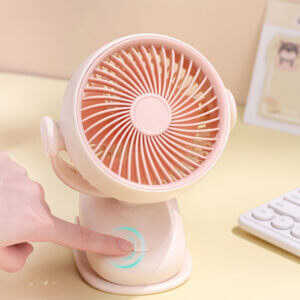 Automatic Oscillating Clip-on Desktop Mini Fan, showing its mint green appearance, spiral air guide grille, tilt-adjustable U-bracket, and clamp base with control button.