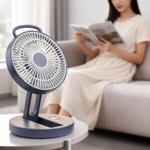 Foldable Portable Wall-Mountable Handheld Desktop Outdoor Fan, showing its top carry loop, circular fan head, folding support arm, back hook mount slot, and circular base with button.
